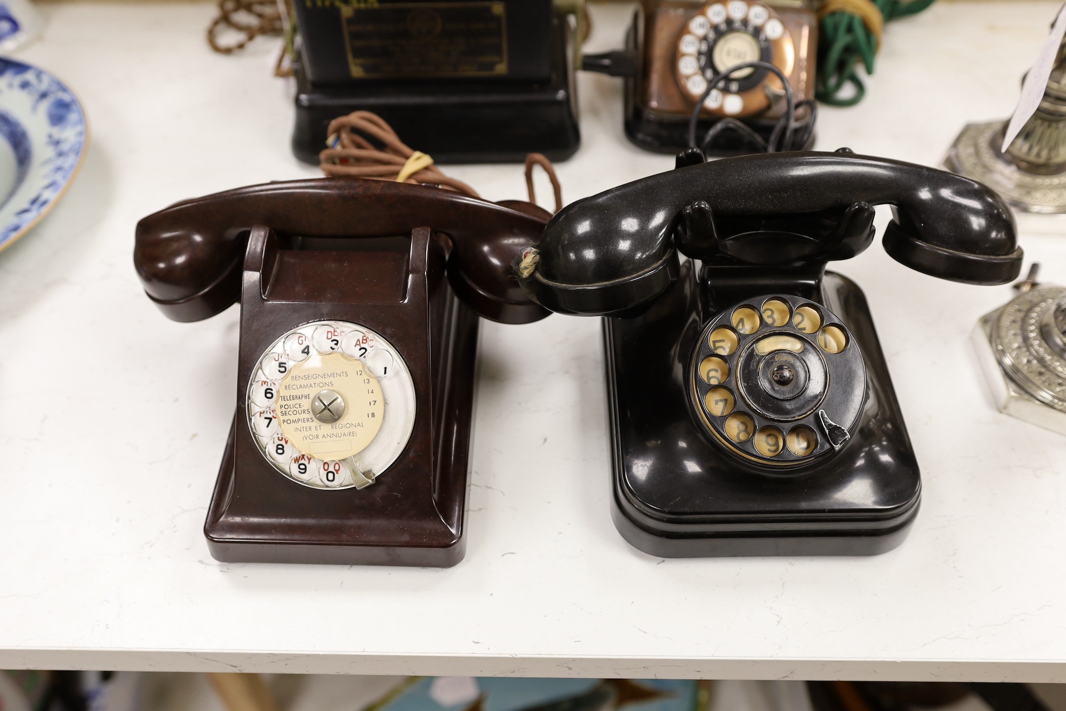 Four assorted Bakelite telephones to include a copper cased example (4)